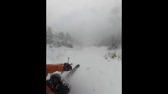Skillful ski down misty mountain slopes in Alta, Utah, USA