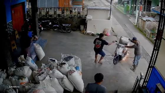 Motorcycle bursts into flames on street in Jakarta, Indonesia