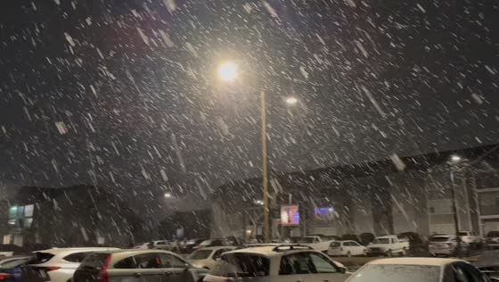 Heavy wet snow reduces visibility in Norman, Oklahoma, USA