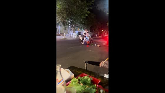 Scooter collision during U-turn in front of traffic police in Hainan, China