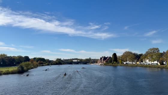 Rowers glide along the Charles River in Cambridge, Massachusetts, USA