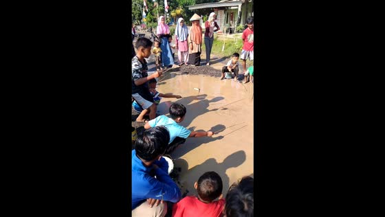 Children fishing in Wonokerto village, Lampung, Indonesia