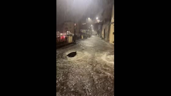 Heavy rain in Naples blows manhole covers off drains