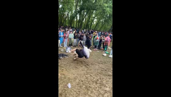 Several men slip and fall on slippery ground in Palencia, Spain