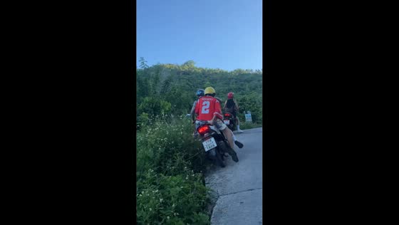 Two motorbikes topple into roadside ditch during uphill stop in Koh Samui, Thailand