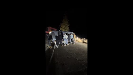 Bystanders unite to right an overturned car in Yunnan, China