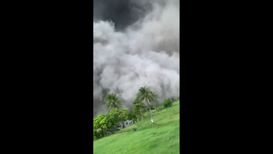 Ash fall from Mayon Volcano interrupts jog in Camalig, Albay, Philippines