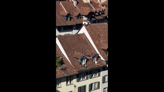 Woman enjoying slow life on balcony in Bern, Switzerland