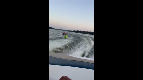 Inflatable sofa riders thrown into lake while being towed by speedboat in Litchfield, USA