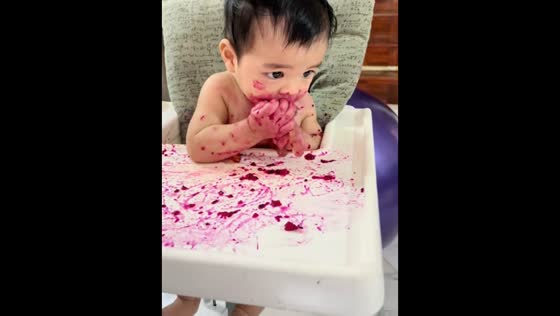 Baby’s eating skills improve from messy hands to neat spoon use in Kuala Lumpur, Malaysia