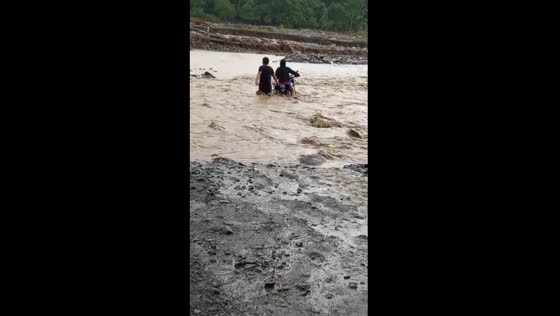 Thrilling triumph: motorbike conquers flooded river in Limot, Tarragona, Davao Oriental