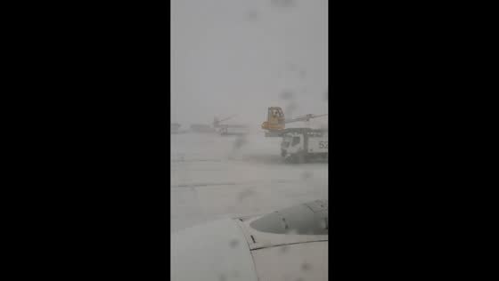 Heavy snowfall disrupts Calgary airport in Alberta, Canada