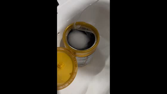 Homemade small washing machine built with milk powder cans in Liaoning, China