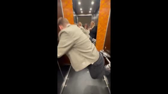 Man breaks an elevator handrail and falls while trying to balance on it in Stockholm, Sweden