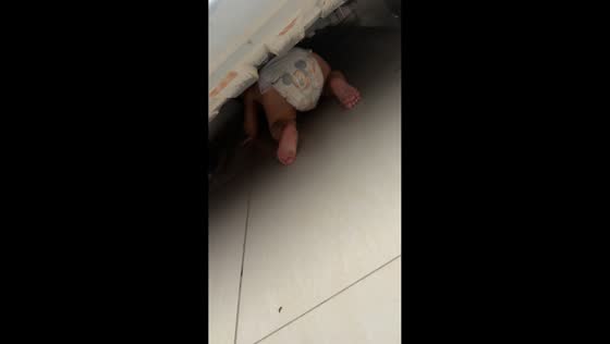 Baby briefly stuck under car in Campinas, Brazil