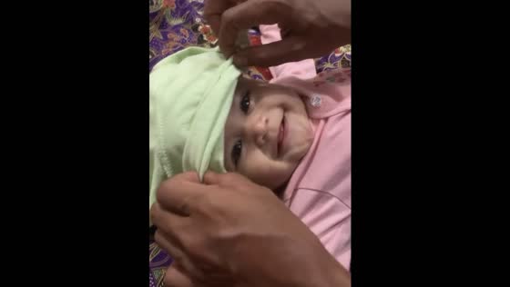 Adorable Baby Shaffiya can't stop smiling while playing with Dad in Kuala Lumpur!