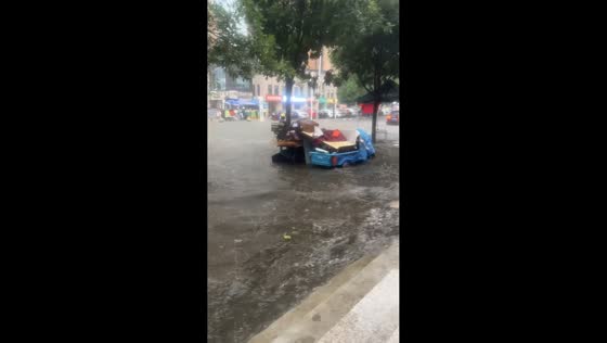 Torrential rain floods streets in Sanhe, Hebei, China