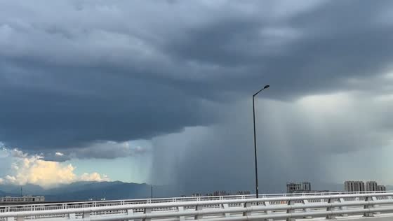 Localized rainstorm seen in the distance in Shaanxi, China