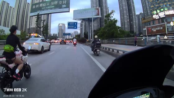 Motorcyclist collides with car after sudden stop at intersection in Guizhou, China
