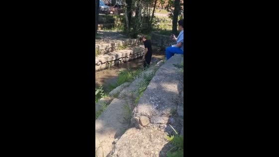 Teen falls while jumping over stream in Braha, Ukraine