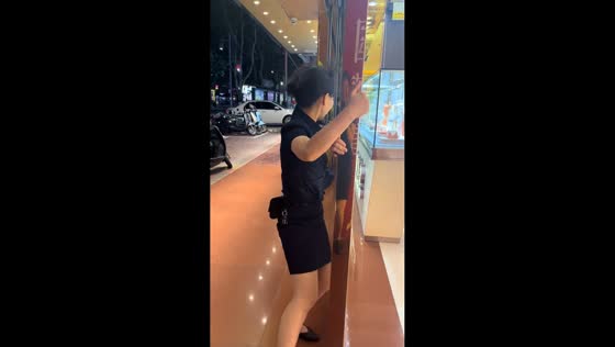 Woman struggles against strong typhoon winds in Guangxi, China