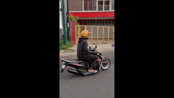 Rider skillfully rides motorcycle with only front tire in Cirebon, Indonesia