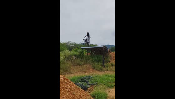 Mountain biker tumbles down rocky trail after failed ramp jump in Liaoning, China
