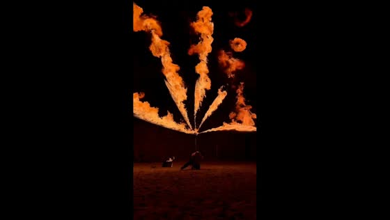 Fire staff performance creates multi-directional flame effect in Belgium