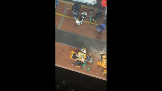 Diners continue outdoor meal during heavy rain in Shaanxi, China
