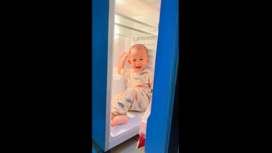 Adventurous toddler finds comfort in the fridge