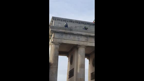 Pro-Palestinian activists protest atop Brandenburg Gate in Berlin, Germany