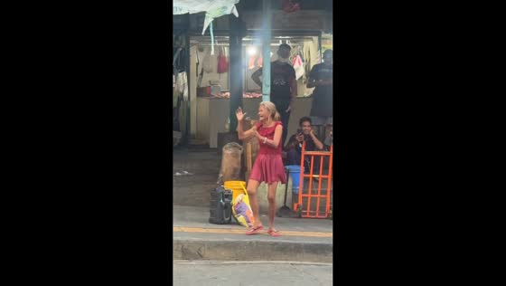 Woman dances in public market and receives support in Baguio, Philippines