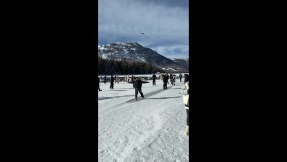 Crowds enjoy sliding across sunlit frozen lake in Fujian, China