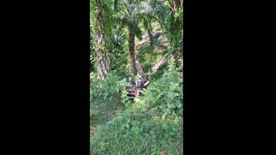 Motorbike load causes fall in rugged terrain