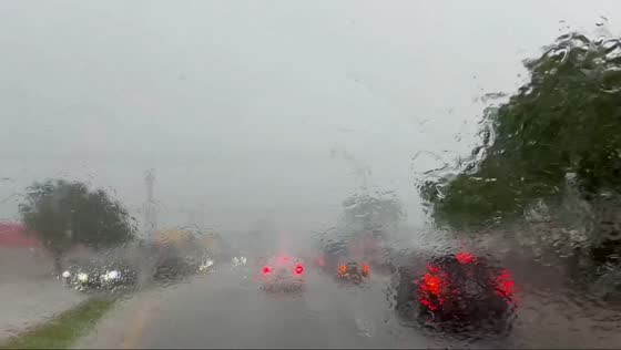 Heavy rain reduces visibility near Amelia Earhart Park in Miami, Florida, USA