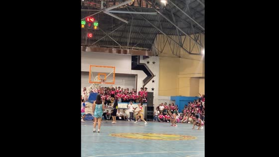 Basketball player scores with backwards volleyball shot in Carcar City, Cebu