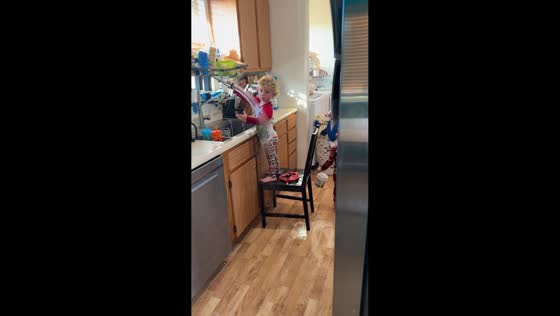 Toddler triplets flood kitchen while playing with sink water in Tampa, Florida, USA