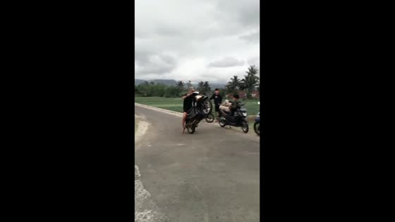 Thrill-seeking stunt goes wrong: hilarious motorbike mishap in Indonesian rice field