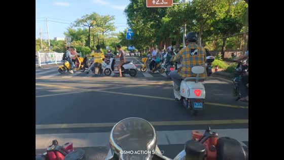 Close call involving scooter rider at a pedestrian crossing in Guangxi, China