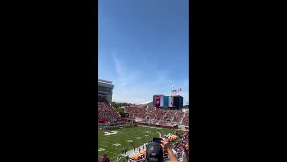 Skydiver gets entangled in scoreboard during Virginia Tech spring game in Blacksburg, USA