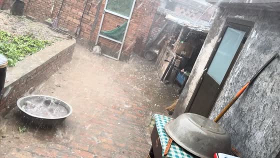 Severe hailstorm covers backyard during heavy rain in Shanxi, China
