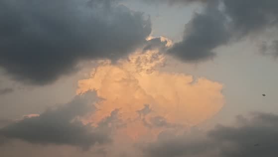 Towering storm clouds create dramatic orange sky over Lahore, Pakistan