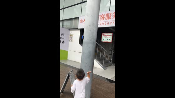 Little boy plays with anti-gravity toy car in Guangdong, China