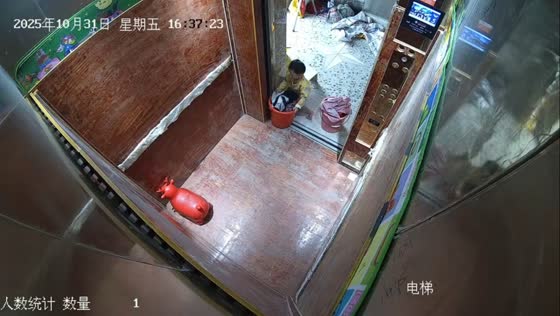 Child helps with laundry using elevator in Guangdong, China