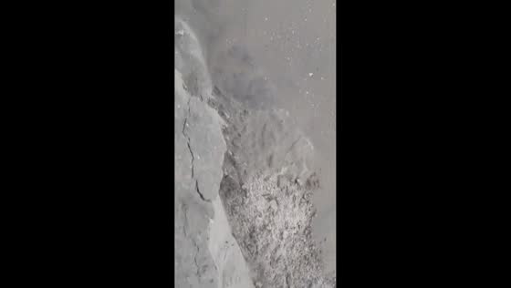 Man falls into ocean after eroded beach edge collapses in New Jersey, USA