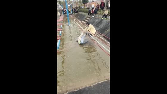 Woman falls into water from rope bridge in Sichuan, China