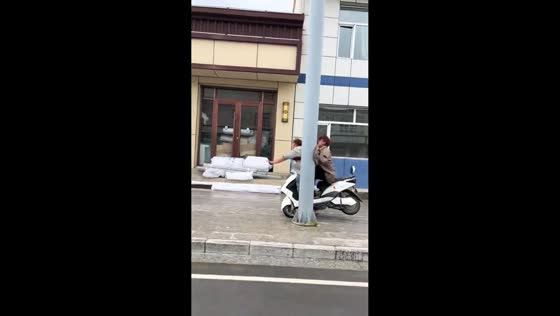 Two men crash into pole while riding motorcycle in Gansu, China
