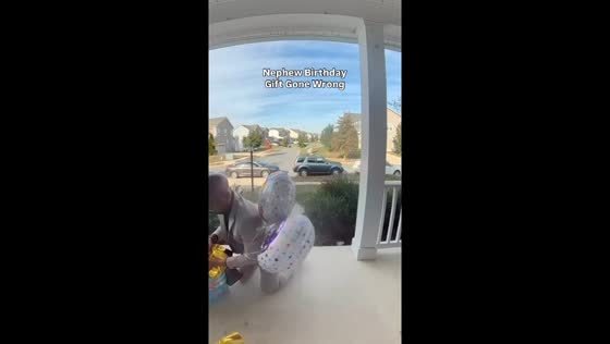 Man trips on front steps while bringing birthday gifts in Waldorf, USA