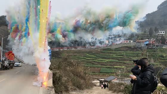 Vibrant daytime fireworks create colorful smoke wall in Sichuan, China