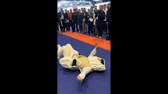 Demonstration of elderly anti-fall safety vest at expo in Guangzhou, China